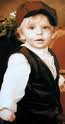 Peter wearing train outfit. If you look closely you can see scars near his eyes.