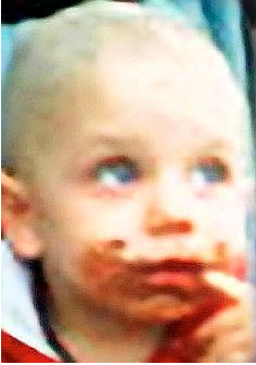 The last picture of Peter. His mother has put chocolate all over his face to hide bruises. His hair is also shaved.